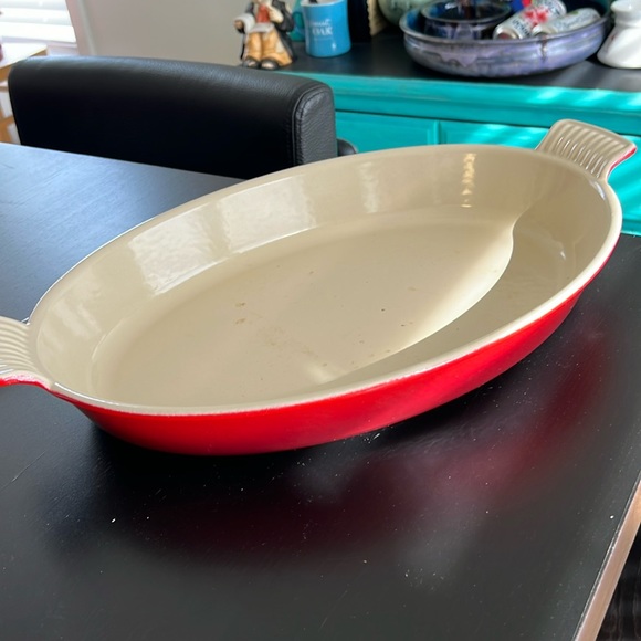 Le Creuset cast iron oval cookware in cerise